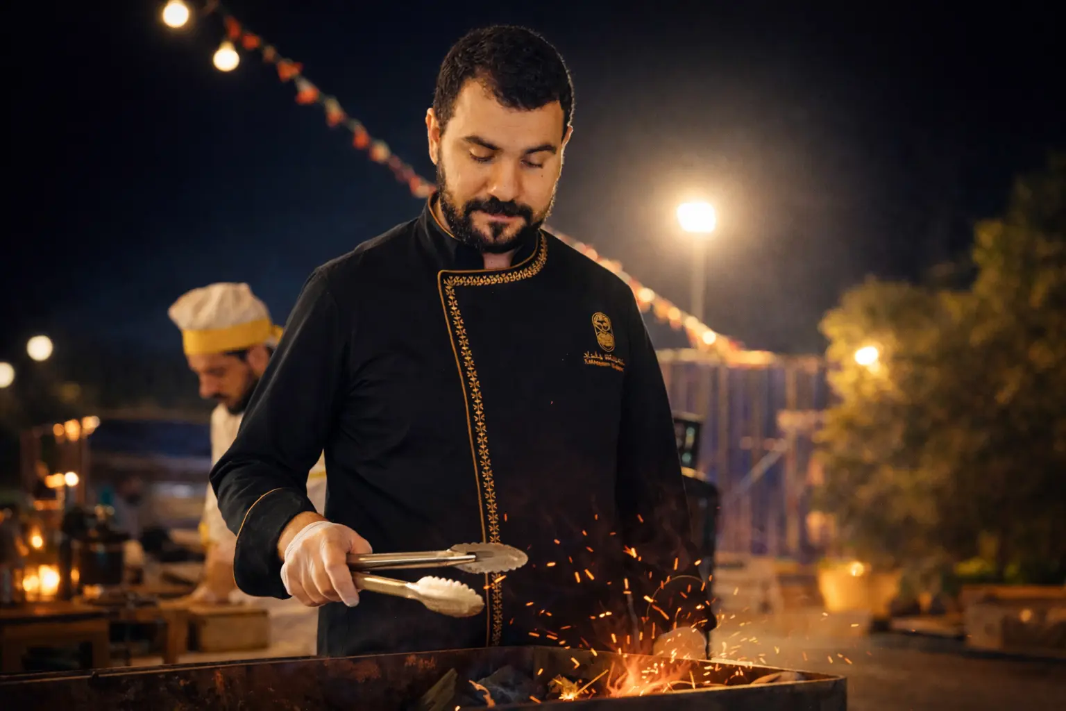 Professional chef preparing live Iraqi BBQ for catering event in Bahrain